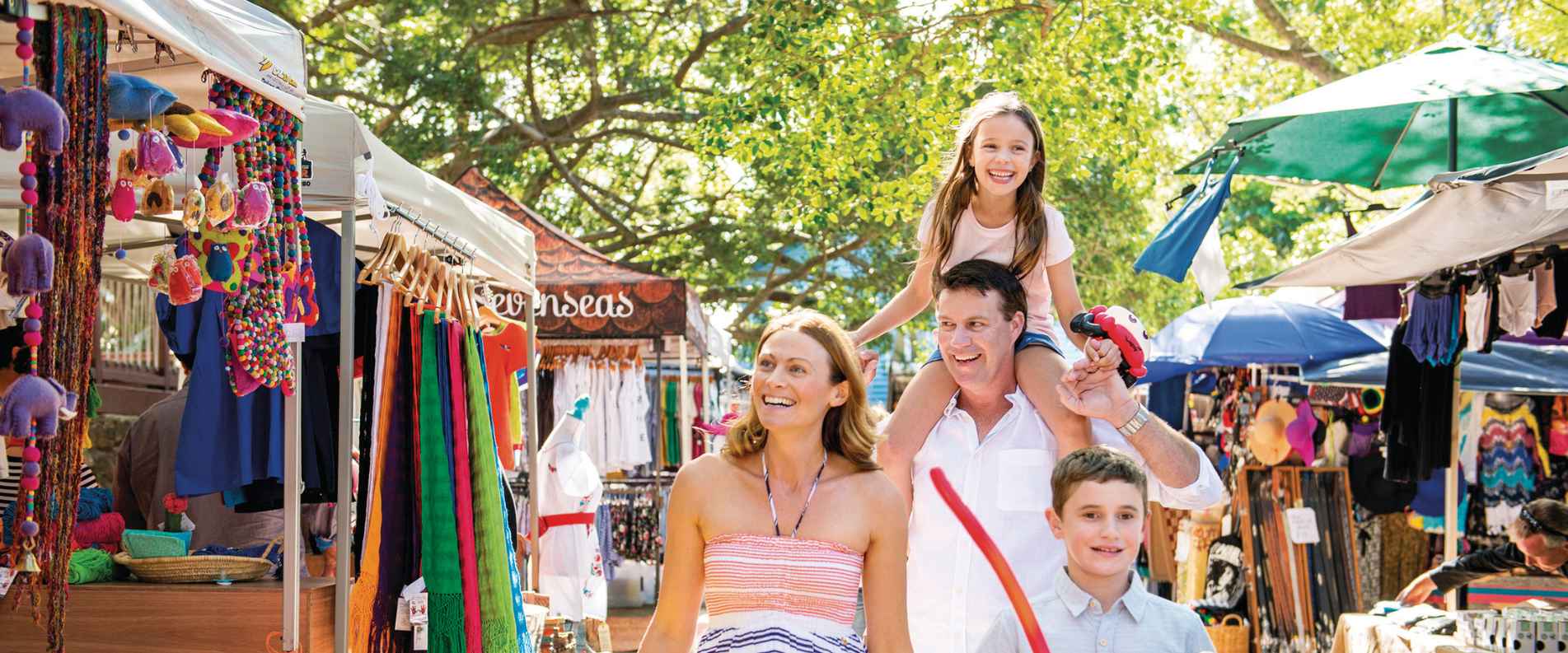 family walking through Eumundi Markets