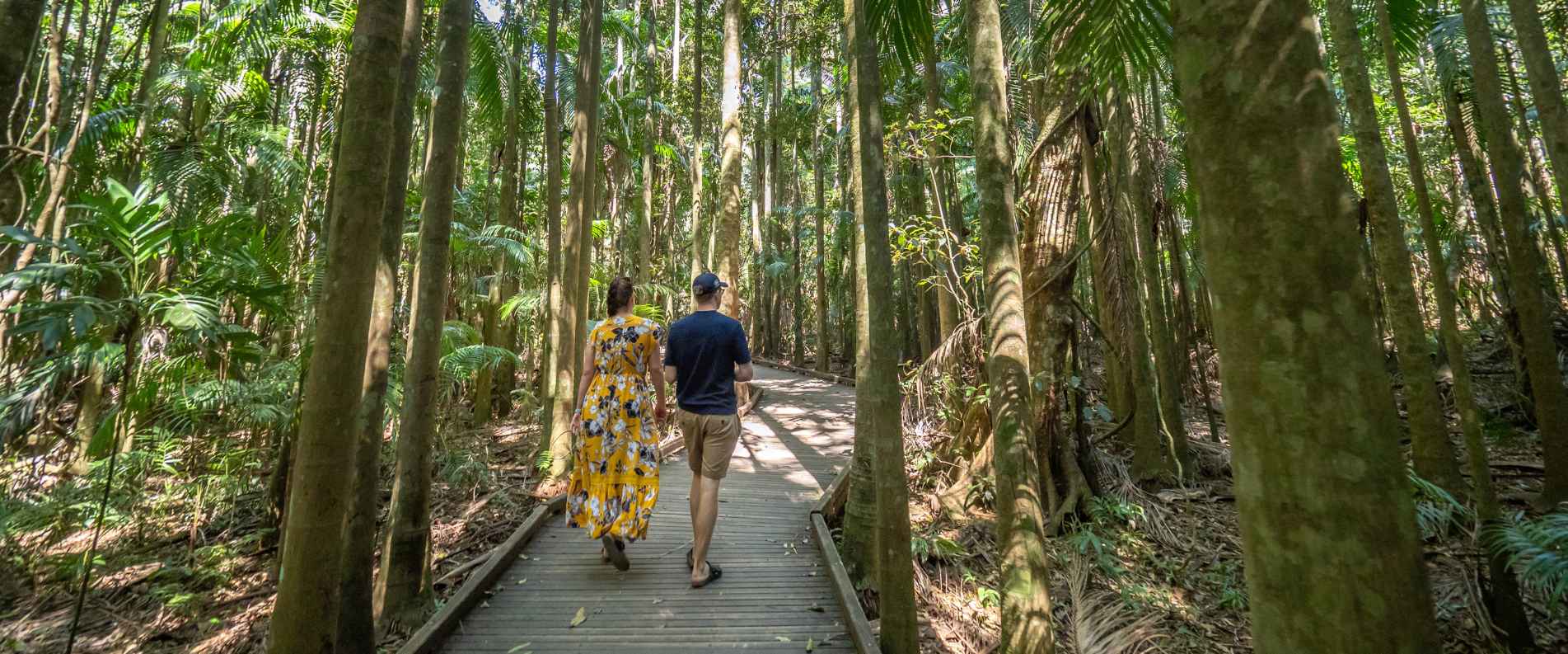Couple walking through forest